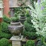 The classical urn standing in front of the temple ruin folly.
