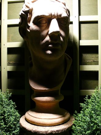 Evening view of the bust of Brutus in the garden.