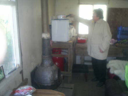lucy making  soup in allotment cabin